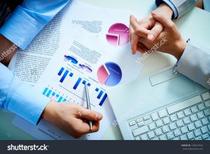 stock-photo-close-up-of-male-hand-pointing-at-business-document-during-discussion-130231046